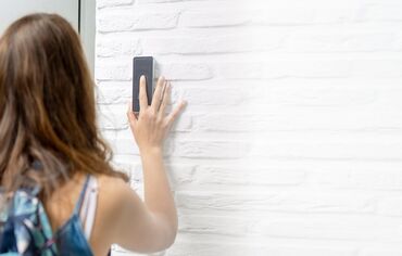 Girl entering white house via fingerprint scanner technology.